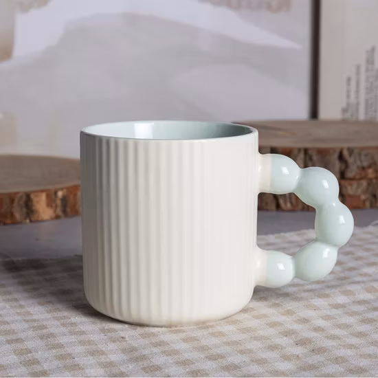 Taza de cerámica promocional vendedora caliente de la atención sanitaria con la manija